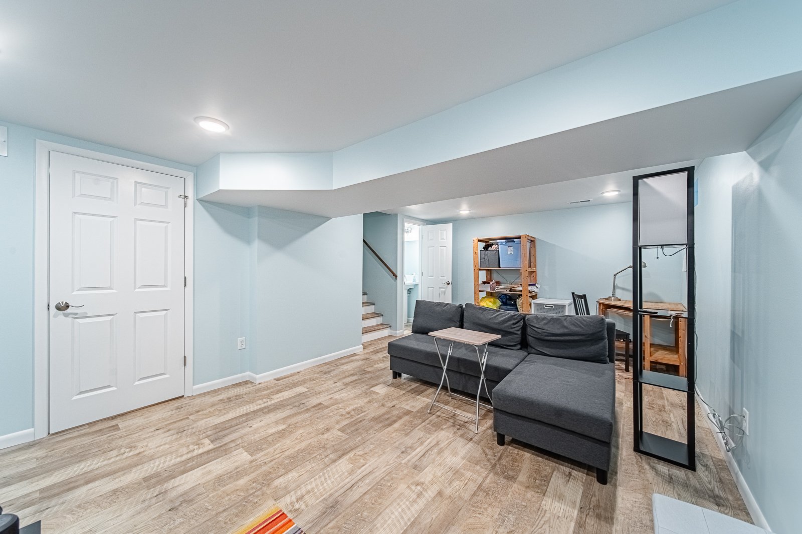 basement-living-room-view-to-bathroom