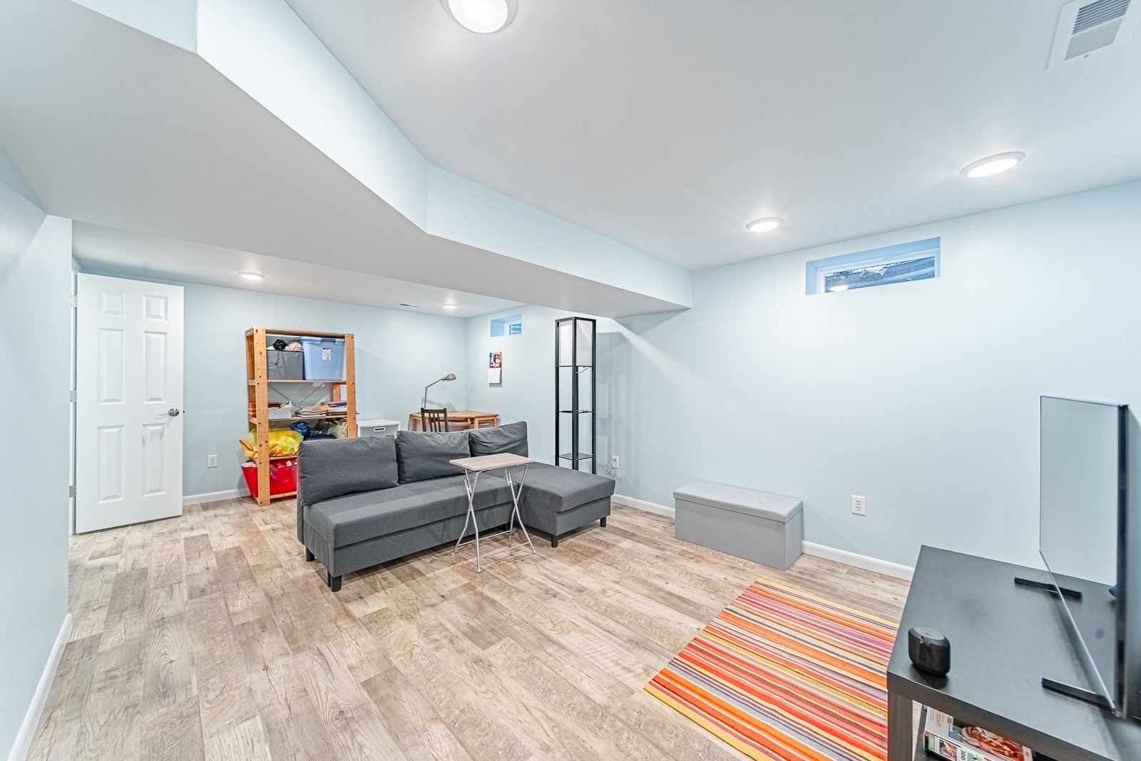 basement-living-area-sectional-sofa-tv