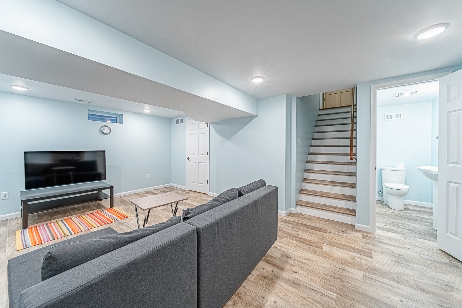 basement-view-from-sofa-toward-stairs