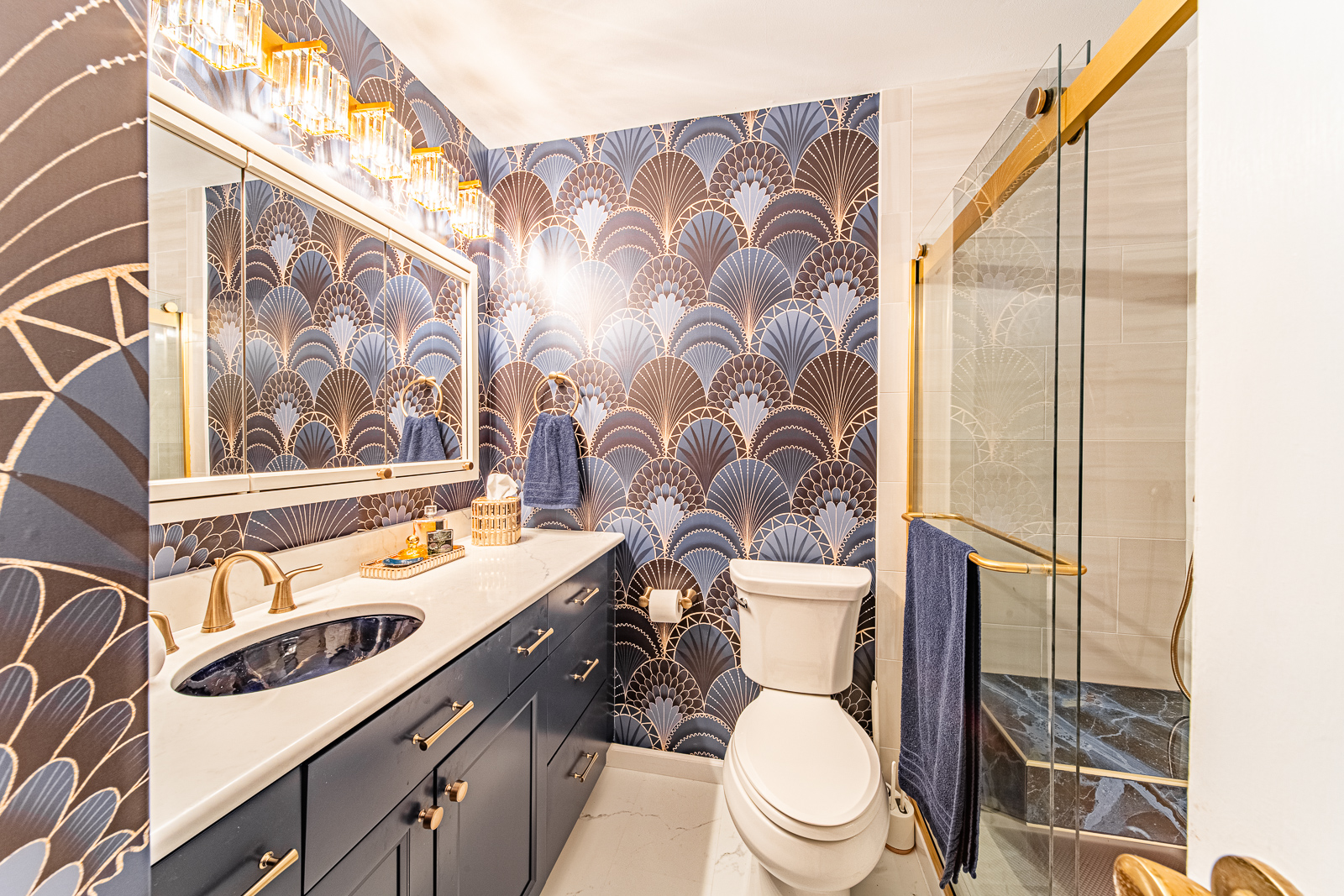 Explore a Lafayette home's multi-space renovation, designed for accessibility with a wheelchair-friendly kitchen, bathrooms, and a leveled family room, all infused with a charming blue theme.