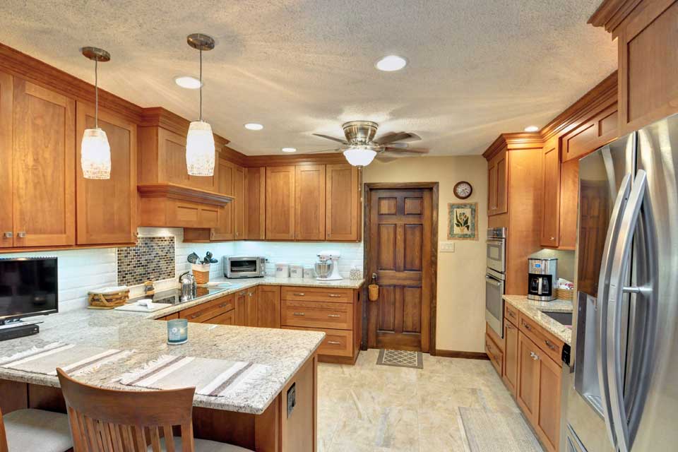 While these Lafayette homeowners were generally content with their kitchen’s overall footprint, they were discontent with the functional use of their space and the dated style. They needed more storage, better functional use of their cabinet space, and a brighter, more sophisticated design. Riverside recommended a pull and replace renovation as the perfect solution.