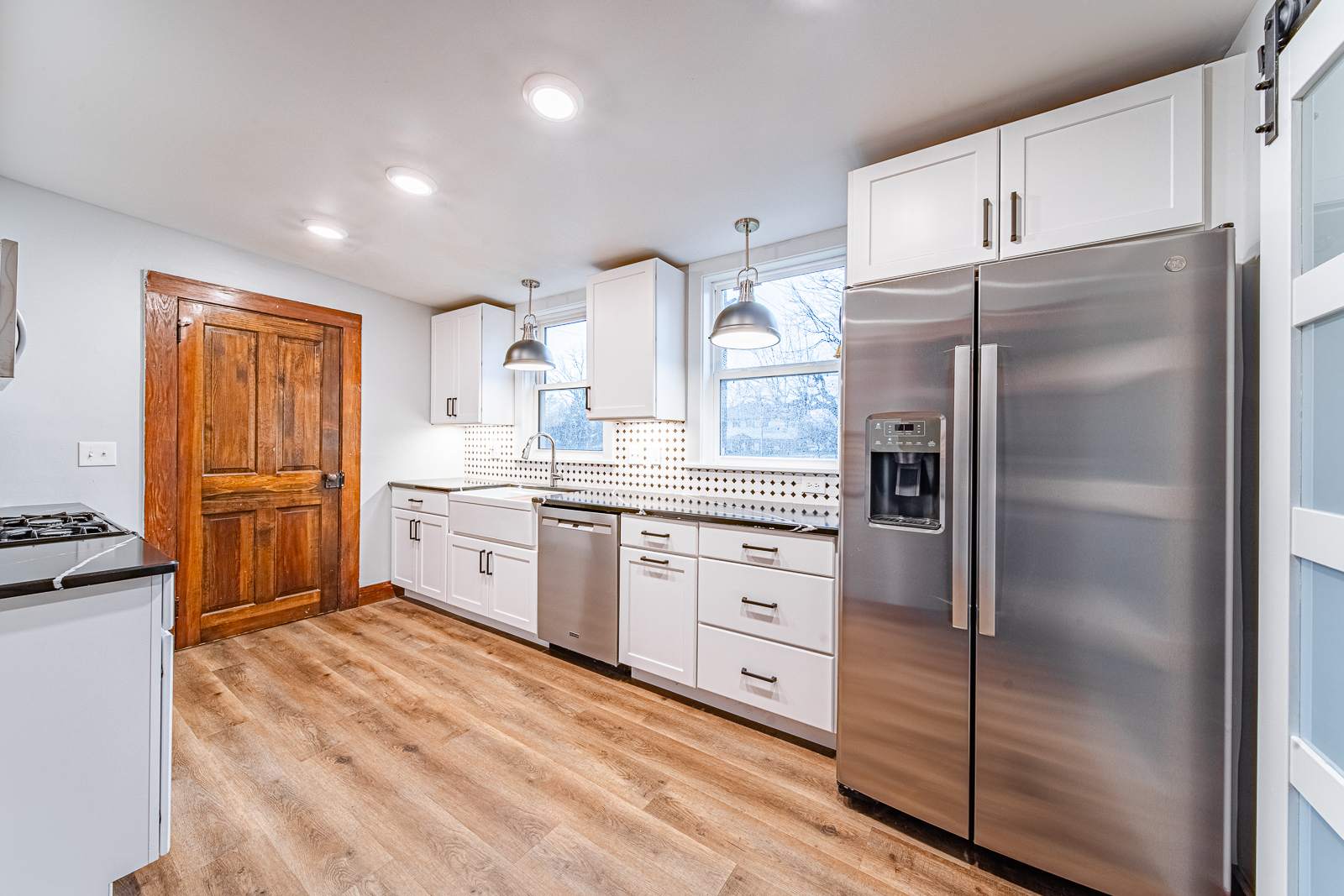 Discover the transformation of a Lafayette home on N. 21st Street, featuring a sleek kitchen and bathroom remodel with custom storage solutions and cohesive designs.