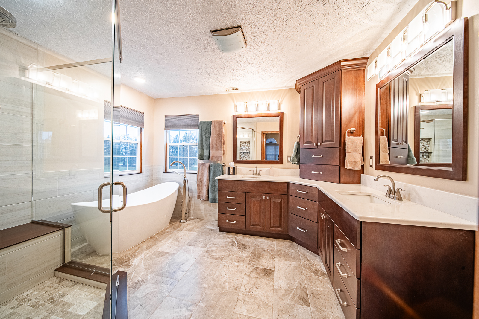 Explore the stunning makeover of a Lafayette bathroom on Huntington Way, featuring a spacious shower, elegant freestanding tub, and modern vanities.