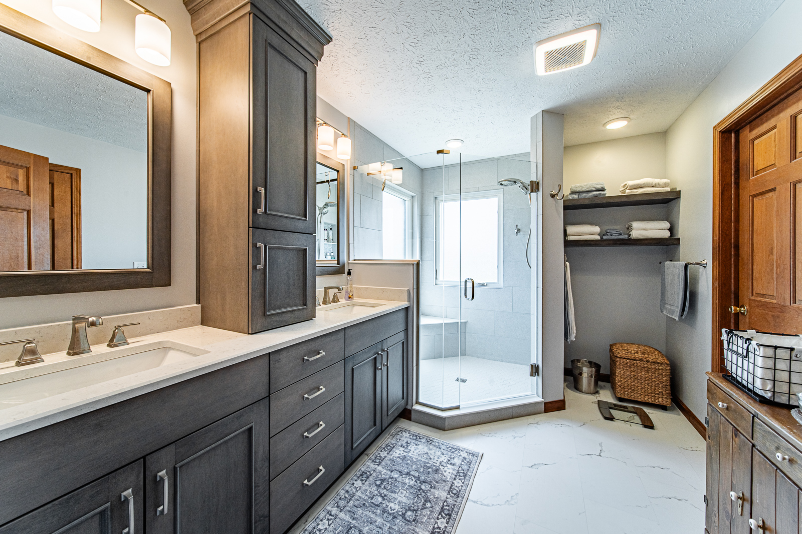 Updated Lafayette master bath with a custom shower, dual vanity, and modern fixtures, enhancing accessibility and style.