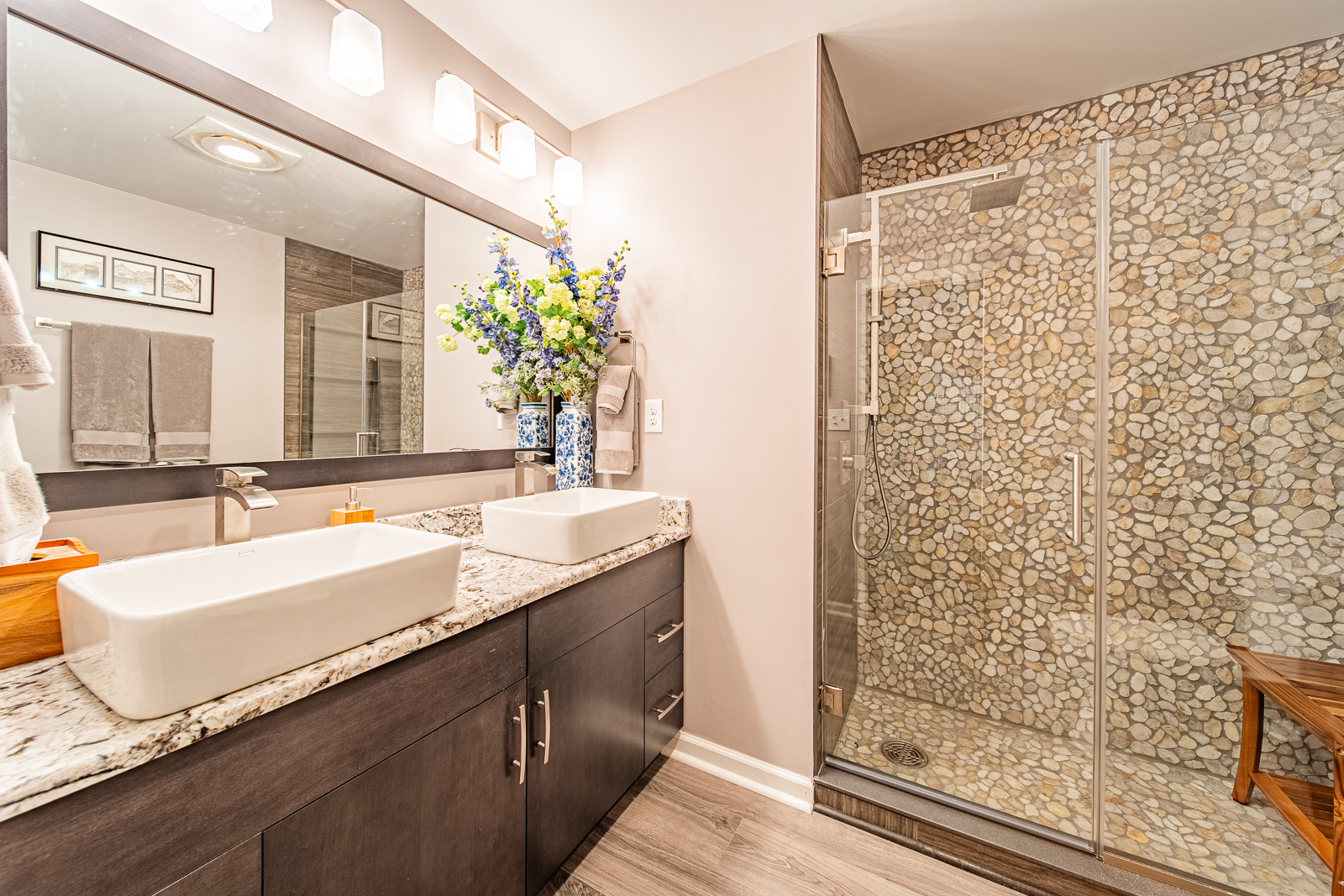 Explore the stylish renovation of a primary and hall bathroom in Lafayette, featuring new fixtures, custom tile work, and modern finishes.