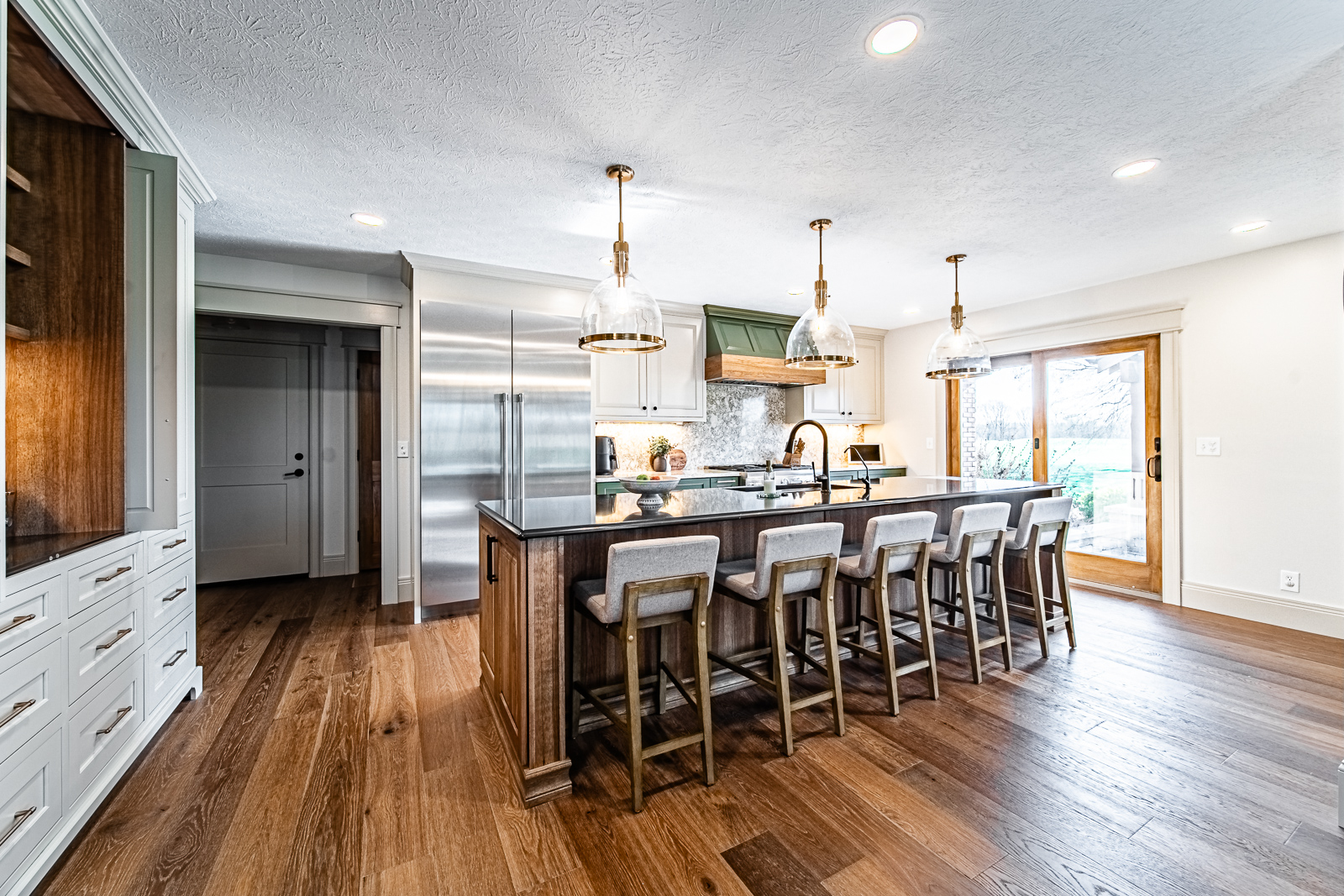 This Frankfort kitchen remodel features a warm blend of natural wood, stone, and painted cabinetry—showcasing timeless style and everyday function.