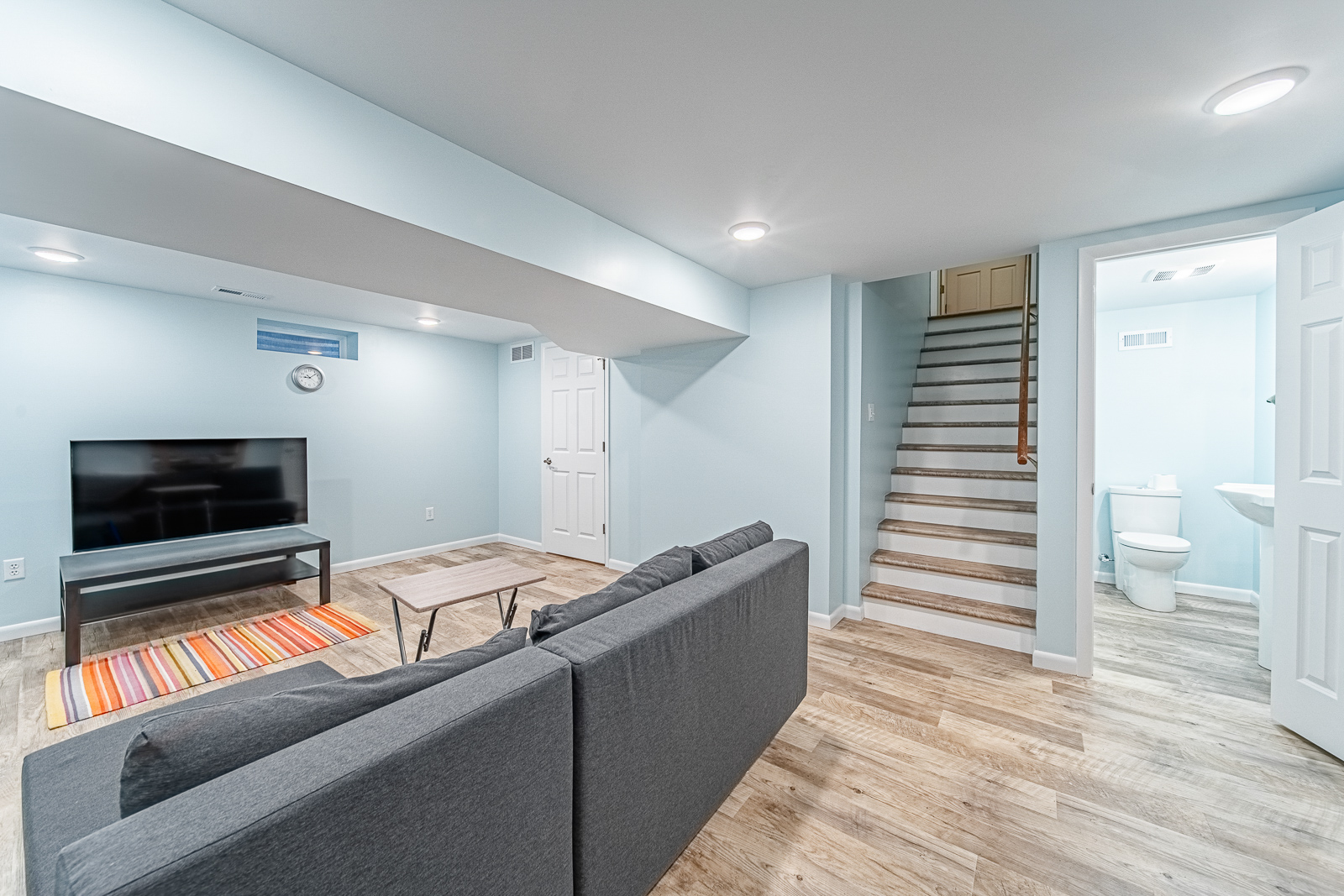 basement-view-from-sofa-toward-stairs