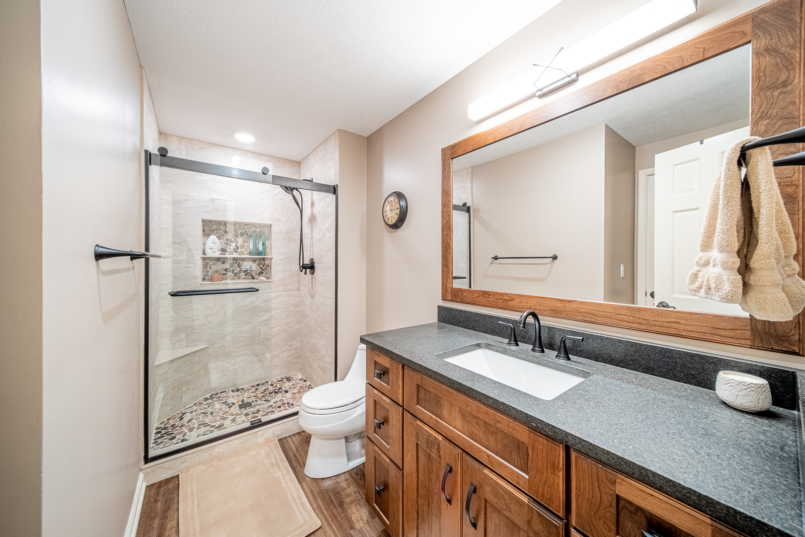 Spacious full bathroom with walk-in shower in Lafayette basement remodel.