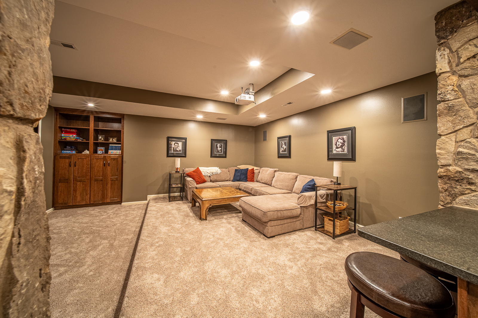 Inviting living room area in the rustic-themed basement remodel on Ripple Creek Drive.