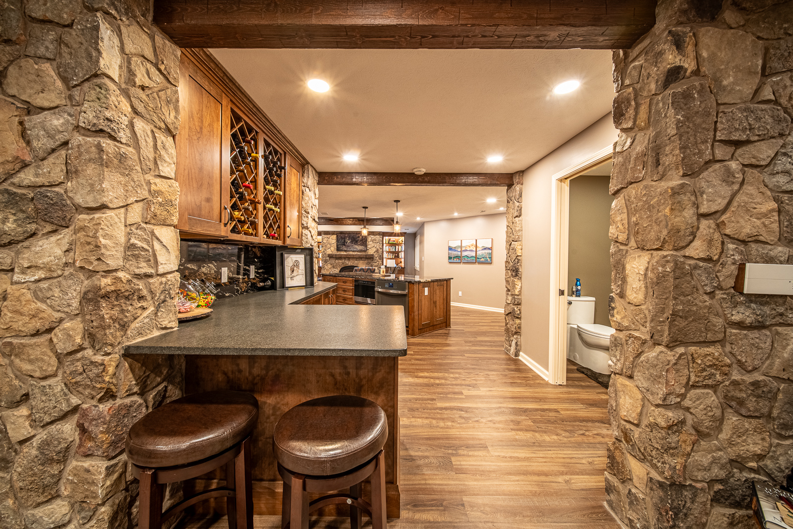 A showcase of the rustic and modern design elements in the renovated basement at Ripple Creek Drive, Lafayette.
