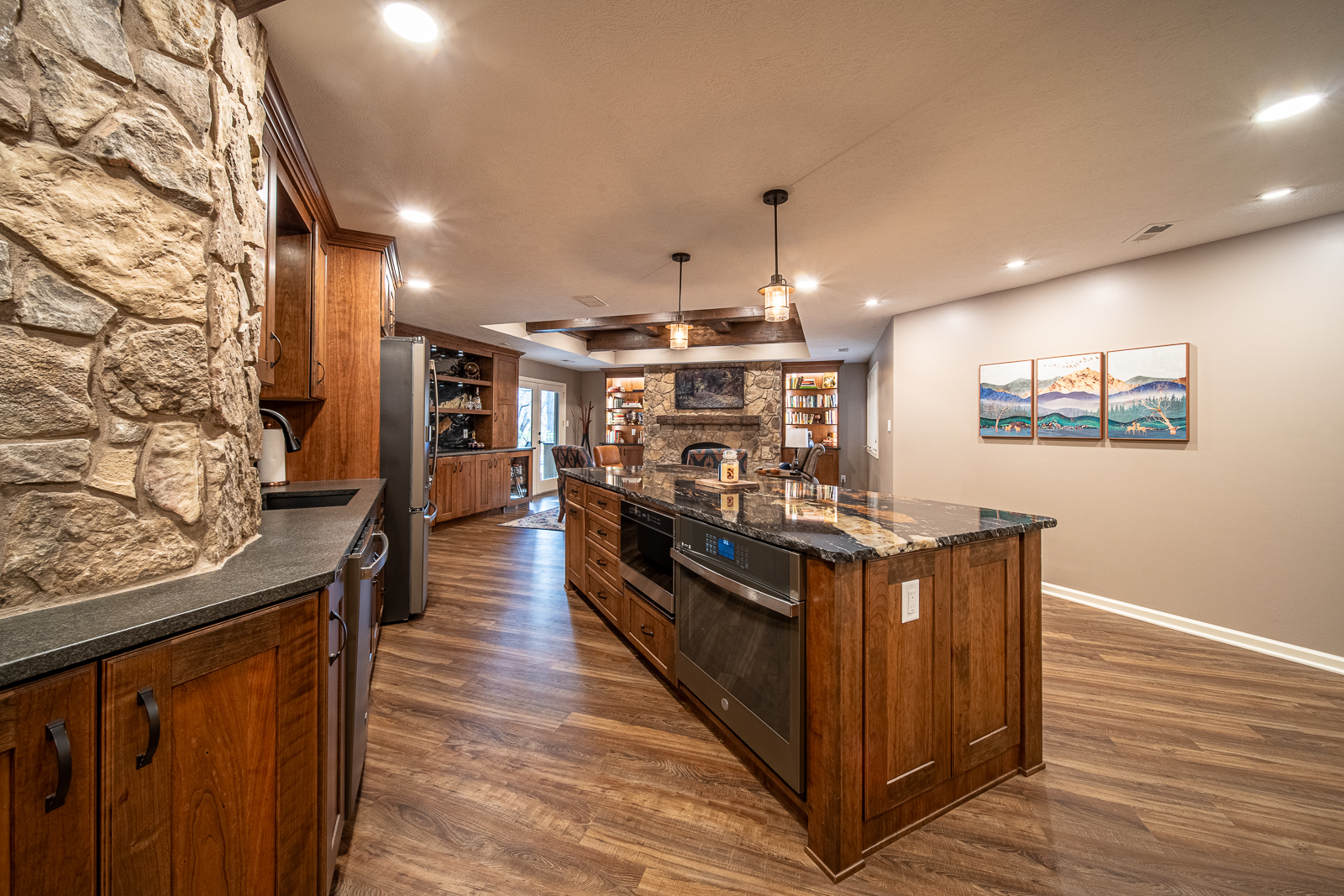 Contemporary basement kitchen with granite countertop and bar seating on Ripple Creek Drive.