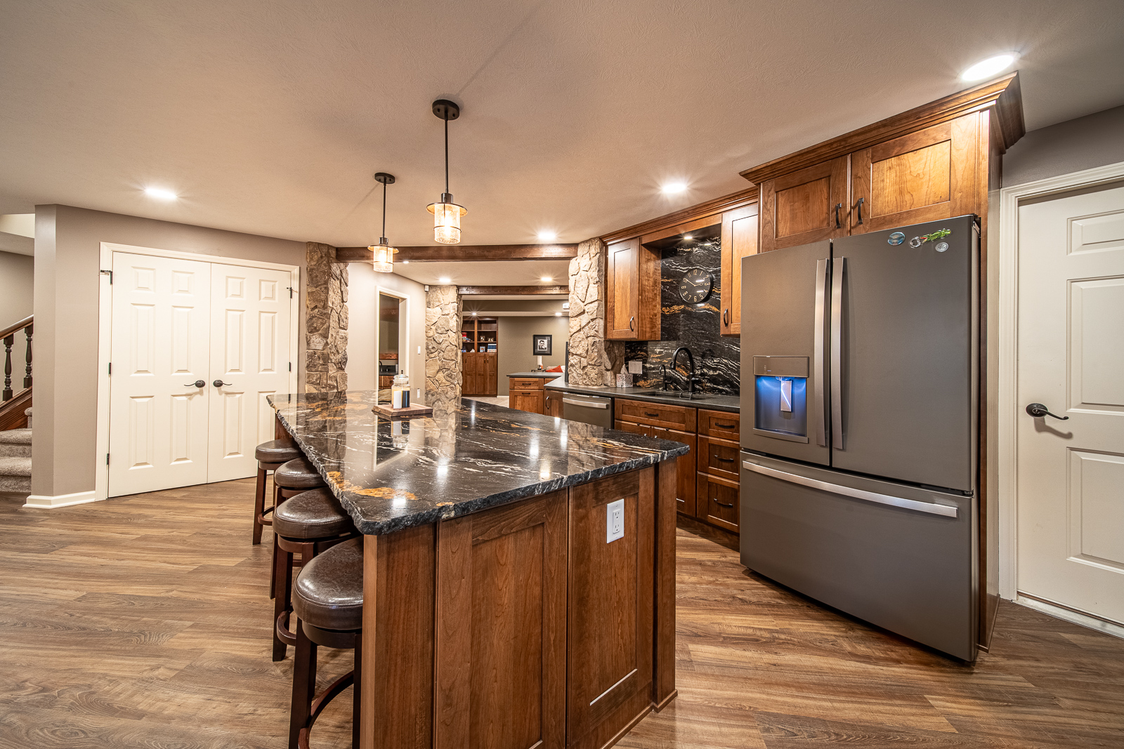Modern kitchen area with full amenities in the Ripple Creek Drive basement remodel.