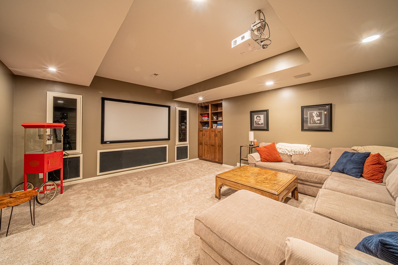 Rustic yet elegant living room space in the remodeled basement of Ripple Creek Drive home.