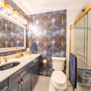 Modern bathroom in Lafayette with accessibility features and a blue marble-like tile theme.