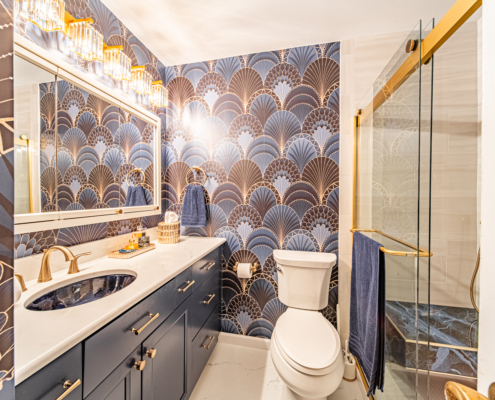 Modern bathroom in Lafayette with accessibility features and a blue marble-like tile theme.