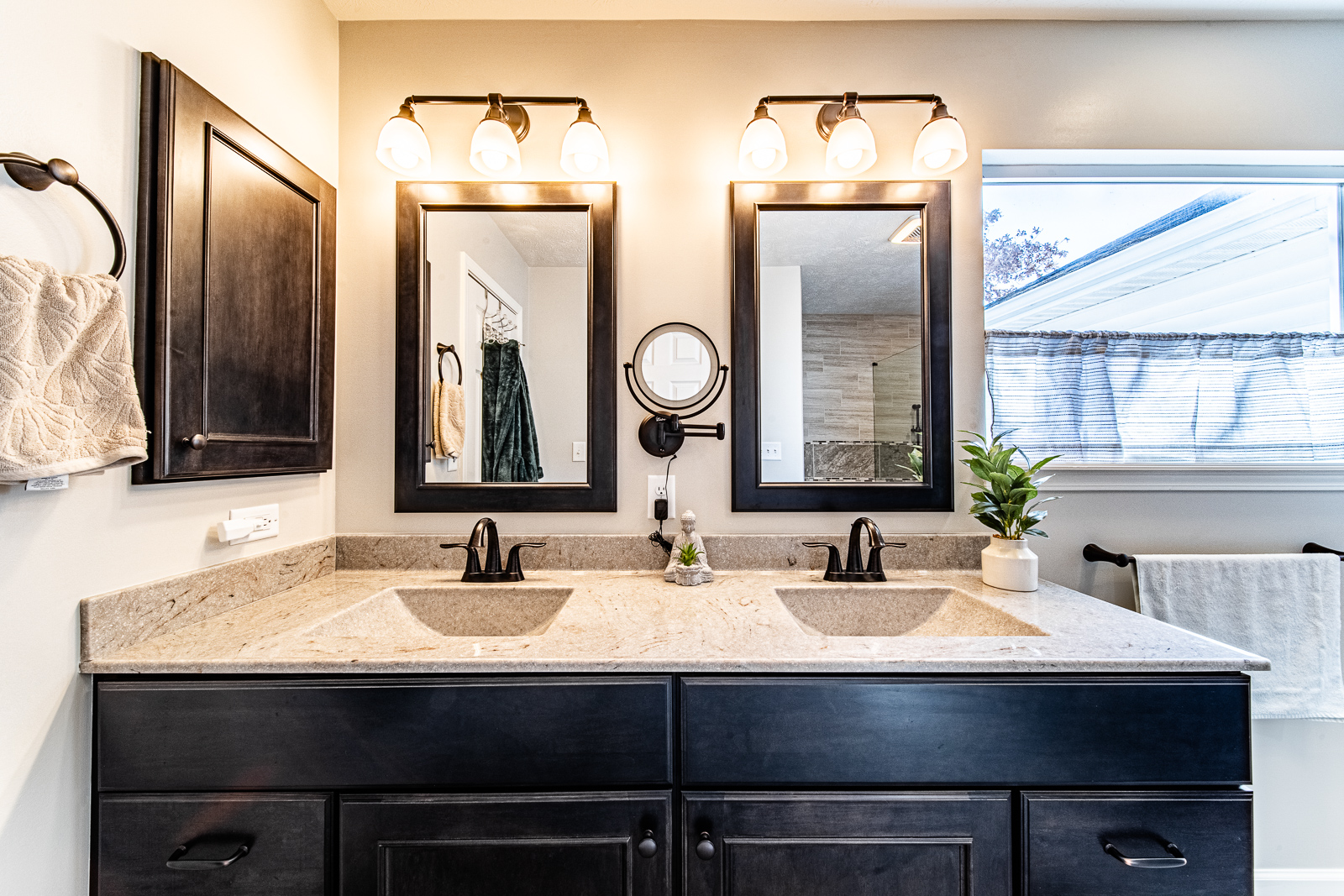 Close-up of the elegant bathroom vanity featuring oil-rubbed bronze hardware in Lafayette home.
